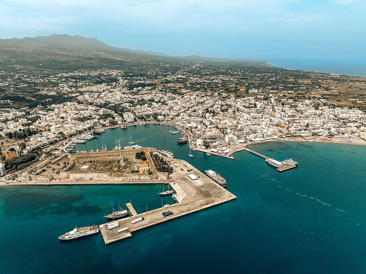 Aerial view of Kos Town harbour with the Castle of the Knights and the Aegean sea